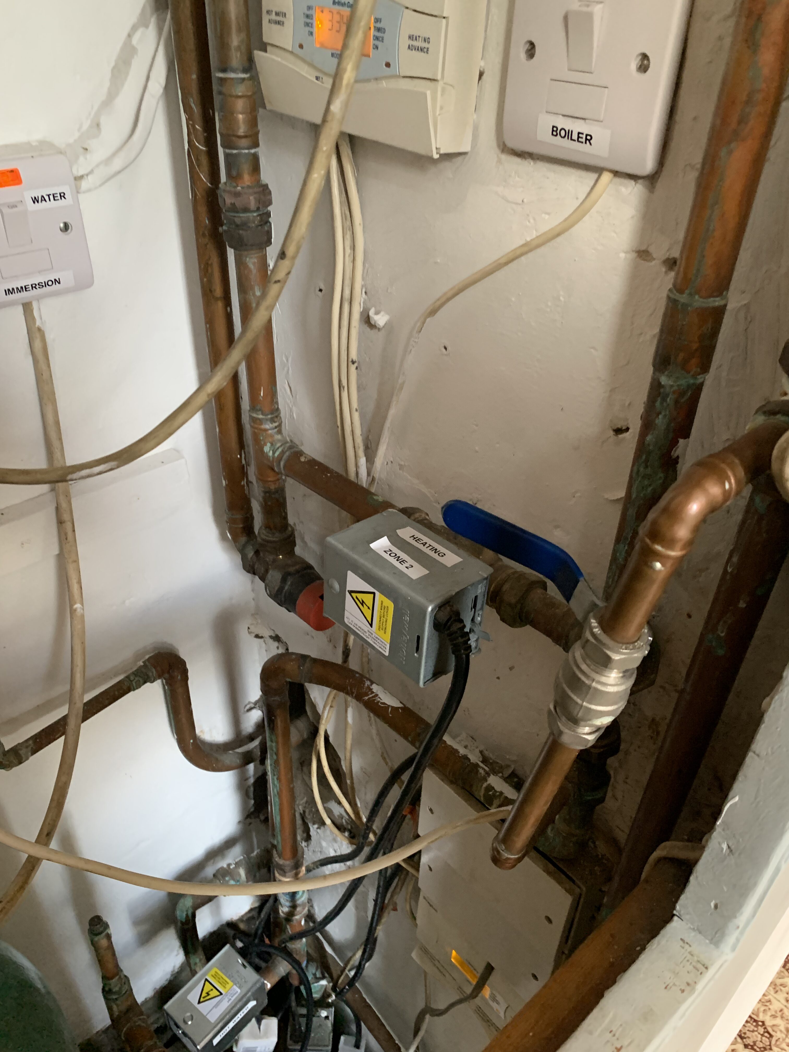 Messy pipework in boiler cupboard