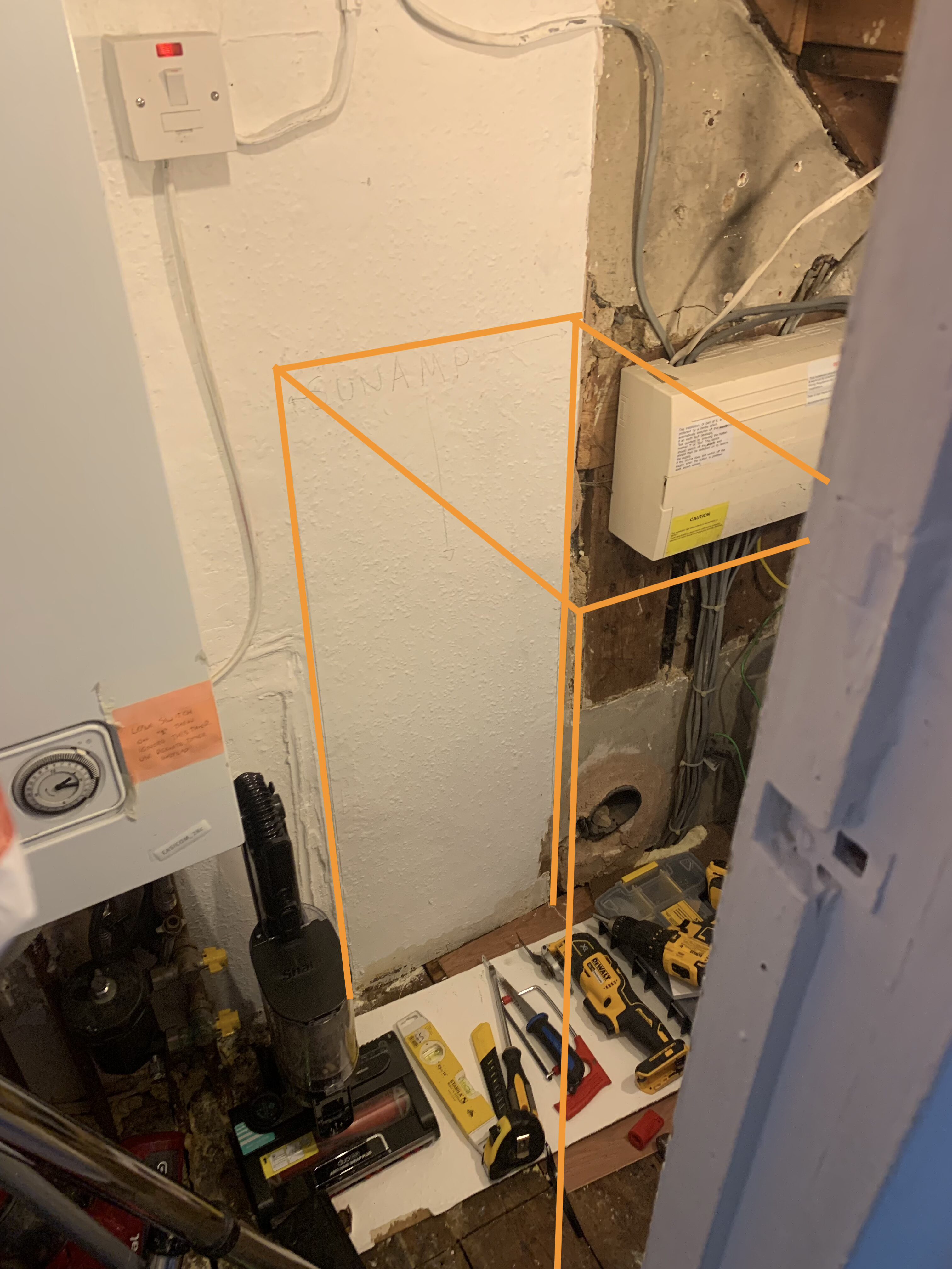 Demonstrating the Sunamp location in the old boiler cupboard