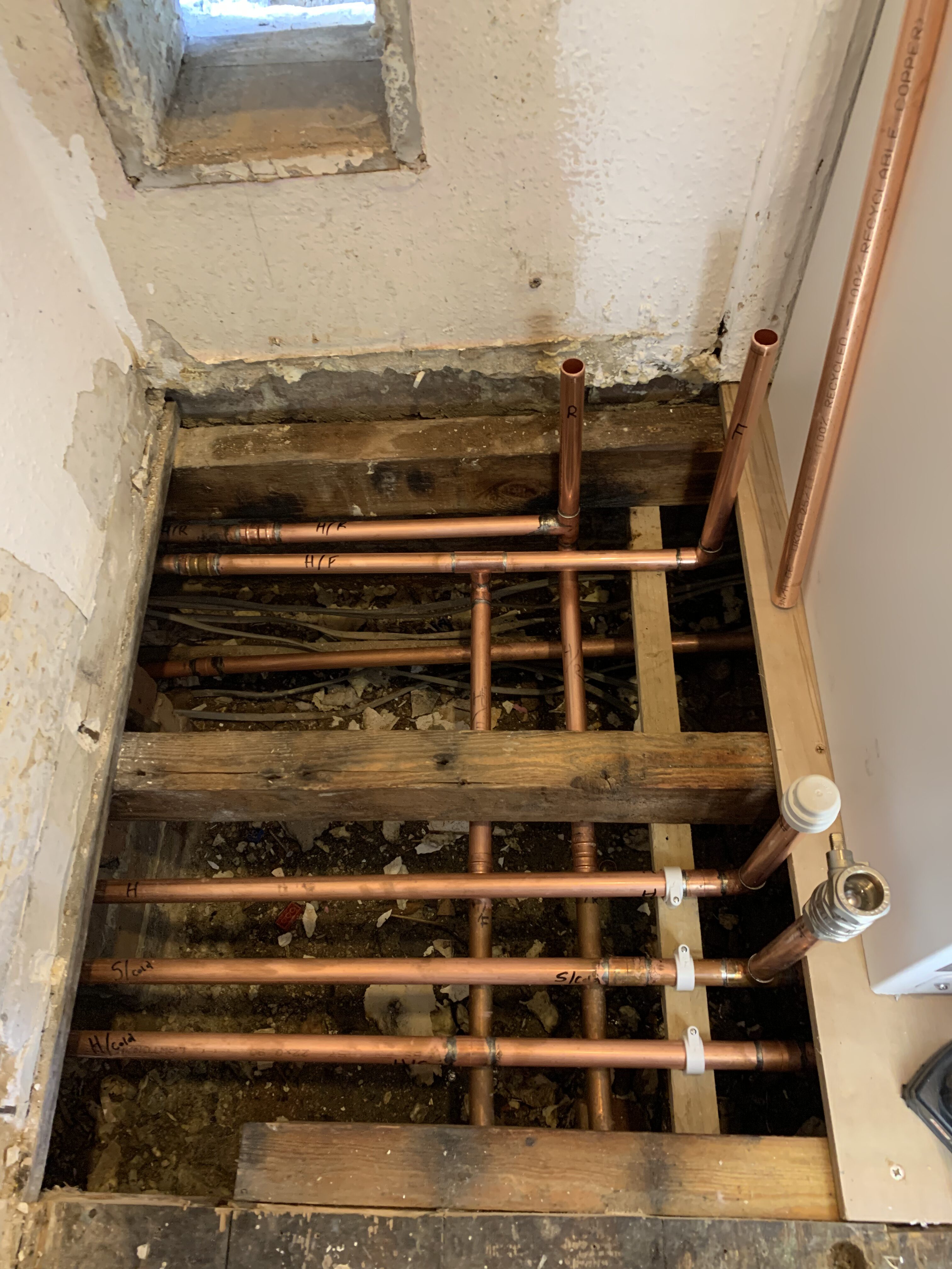Preparing new pipework (including heating pipework) under the stairs