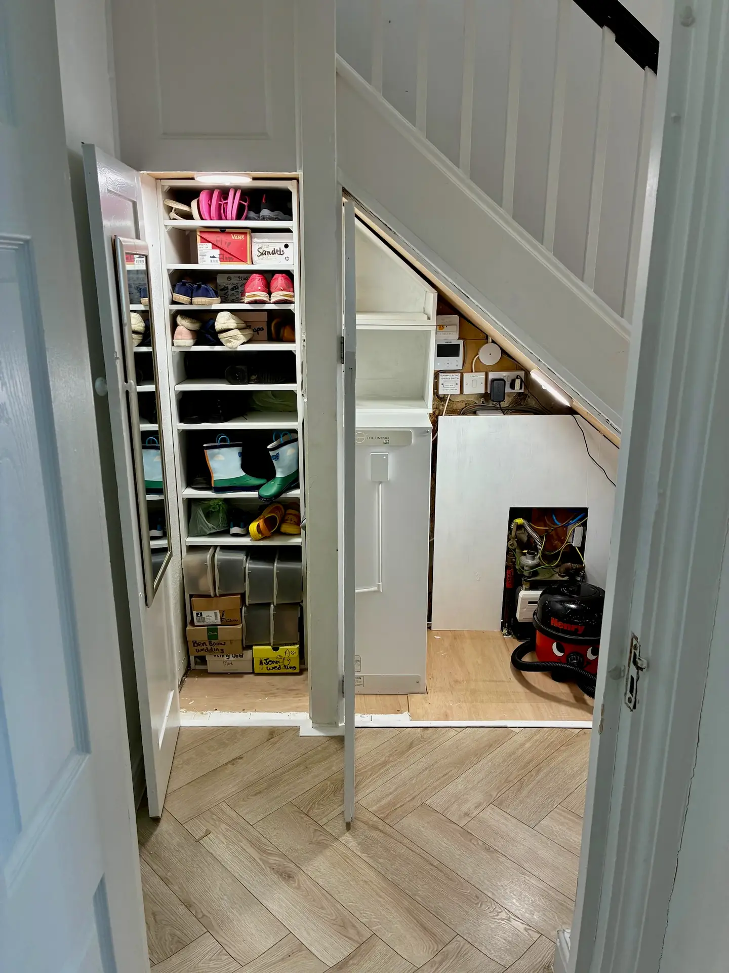 Shelving around the Sunamp built by homeowner (with access for servicing)