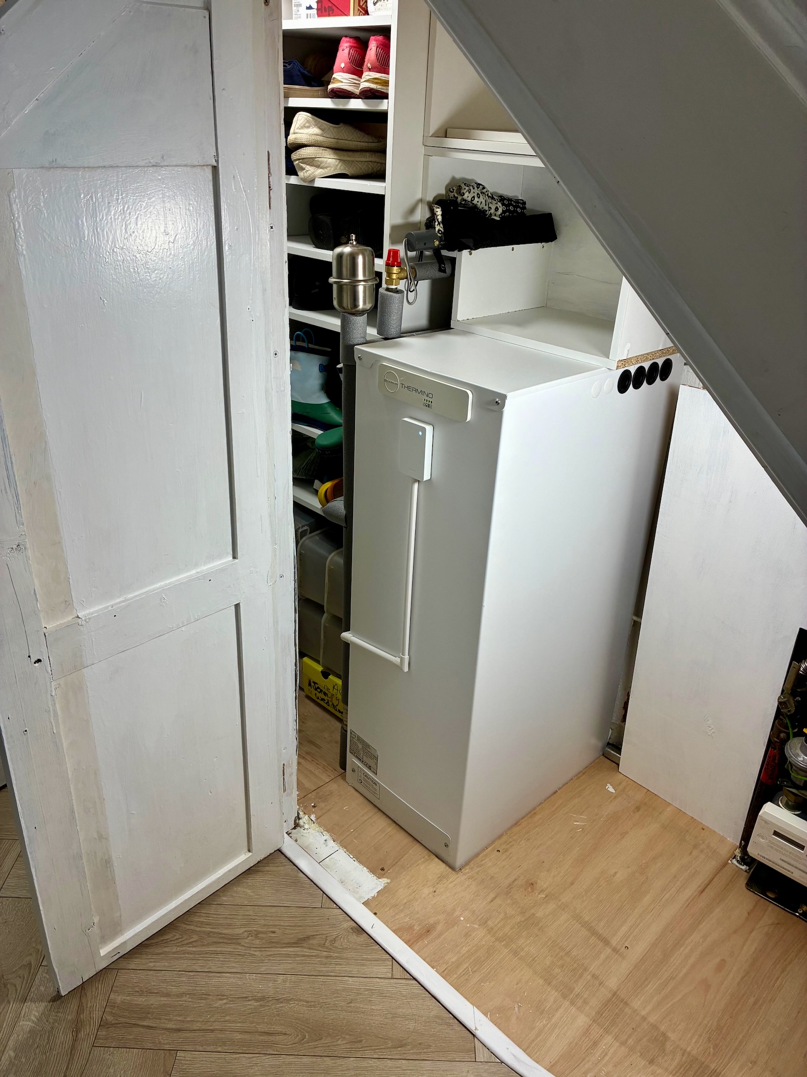 After installation, the customer DIY'd a shoe cabinet and storage around the unit