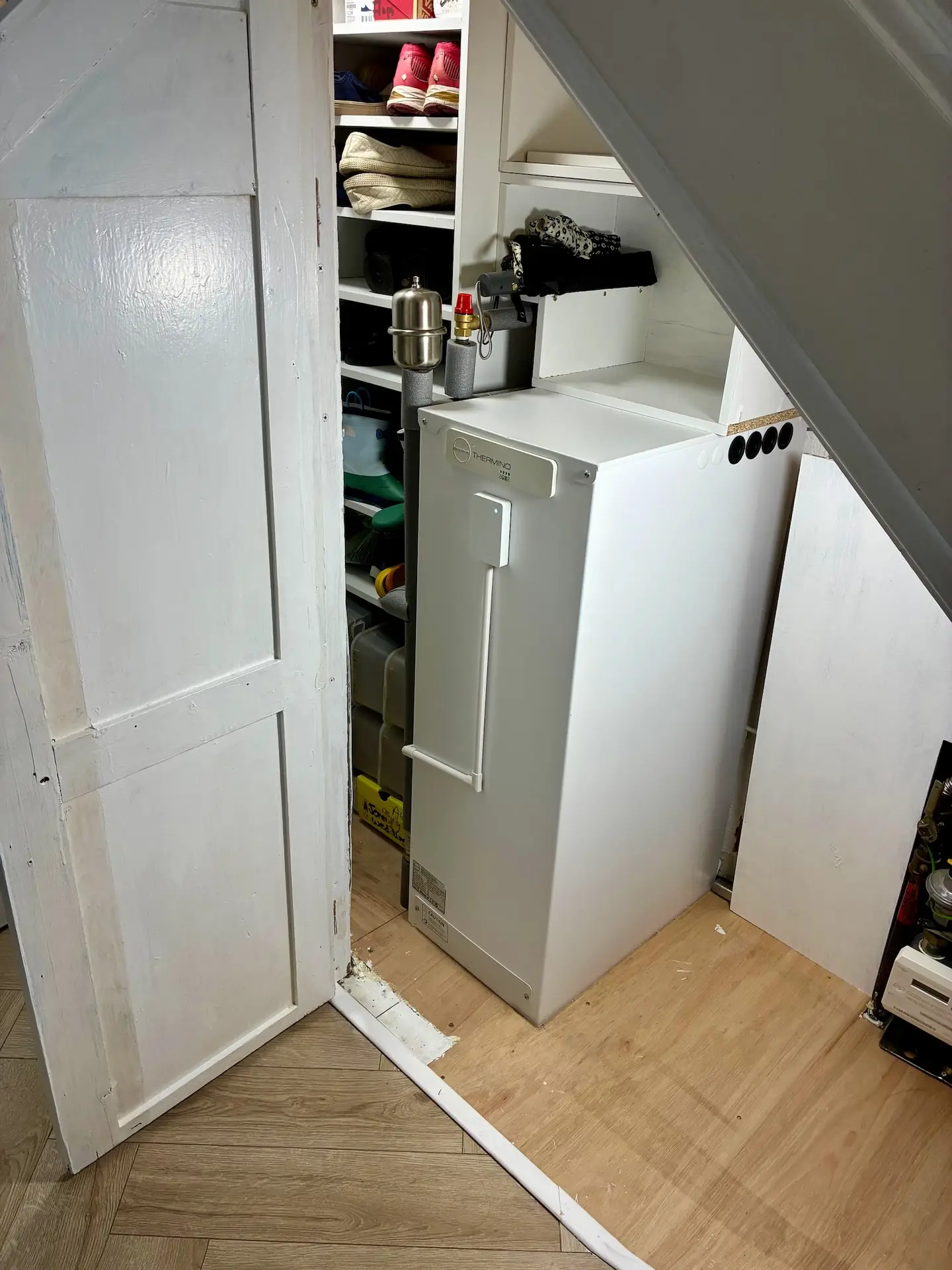 After installation, the customer DIY'd a shoe cabinet and storage around the unit