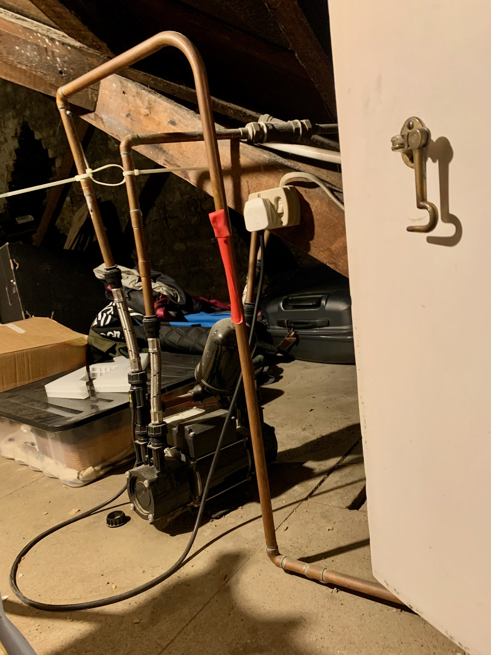 Noisy shower pump in loft