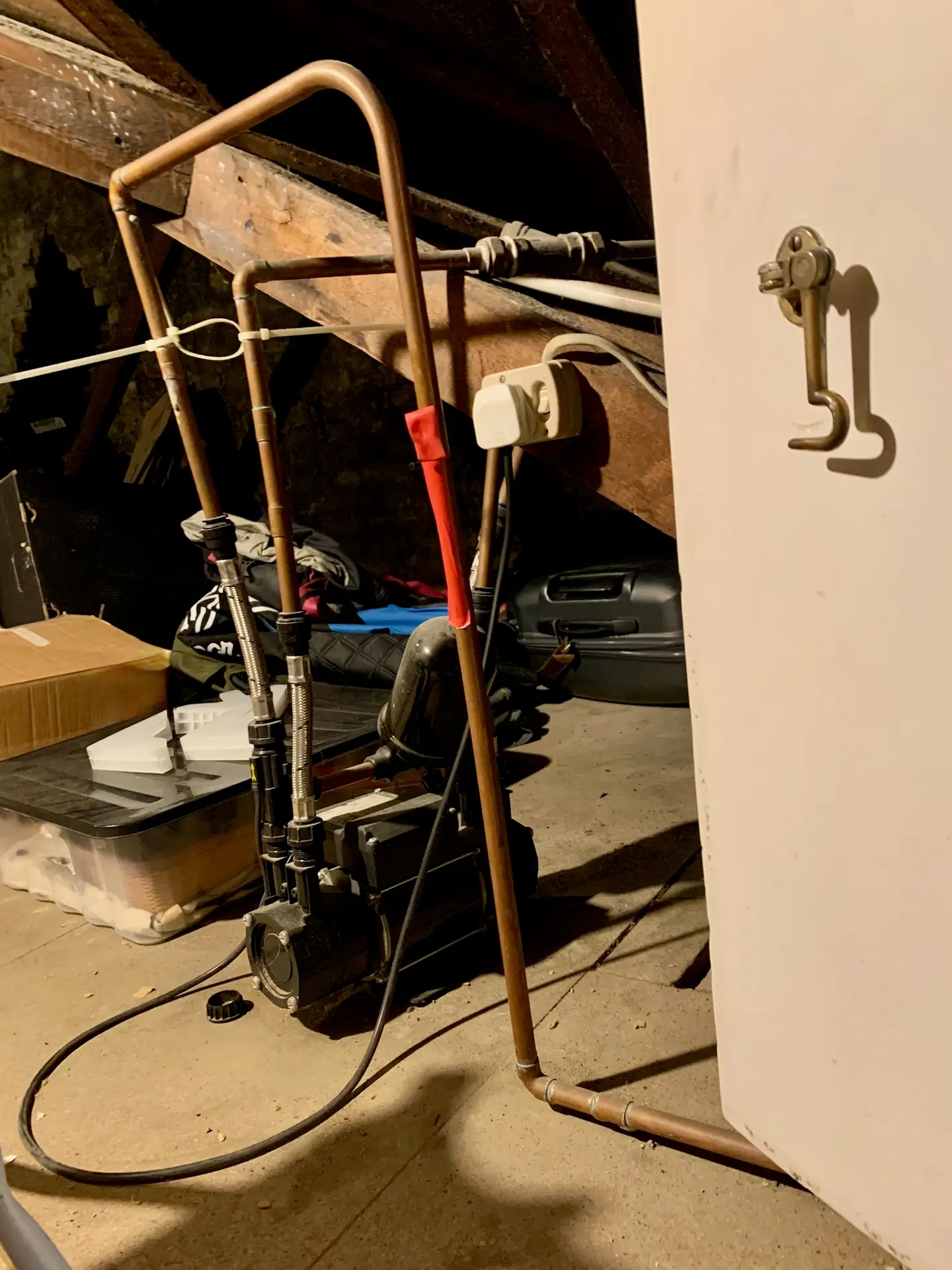 Noisy shower pump in loft